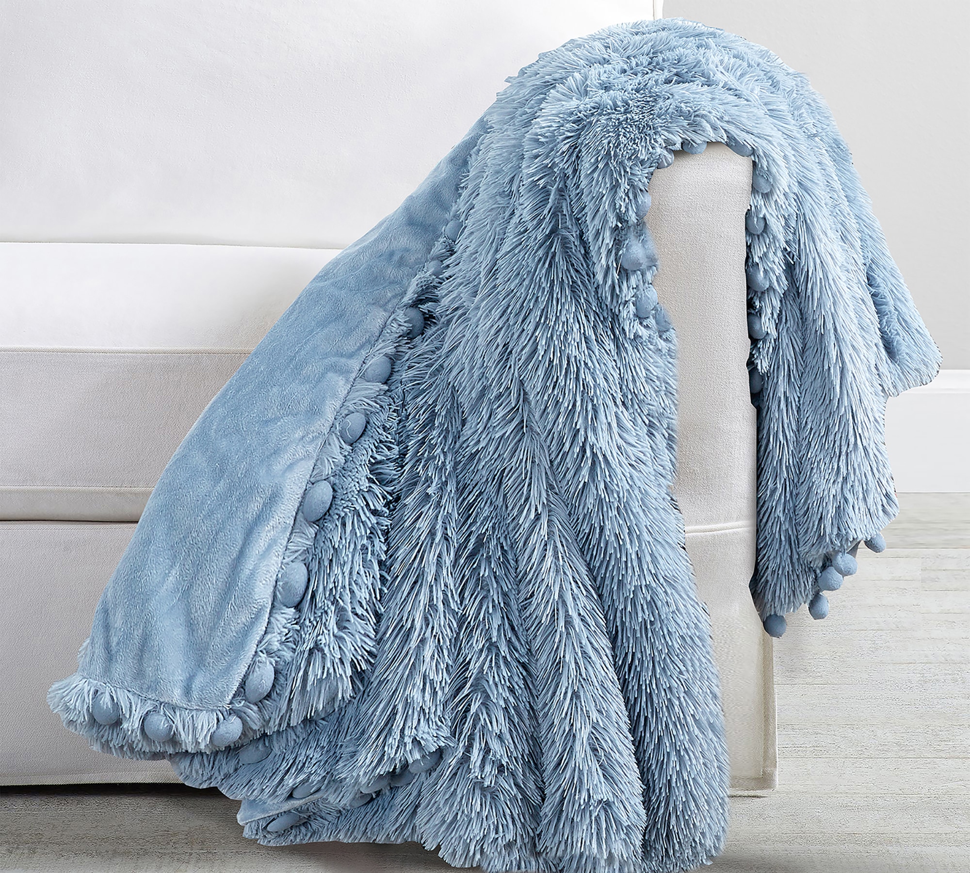 Blue pom pom throw sale