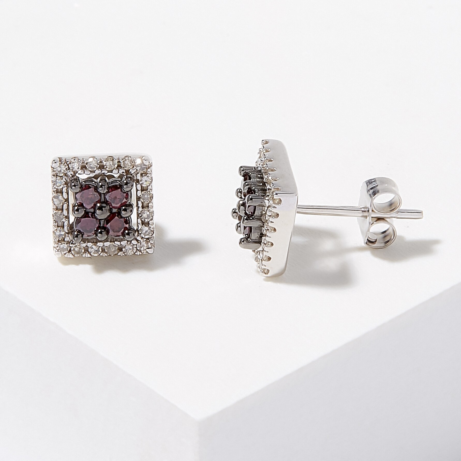 two diamond stud earrings