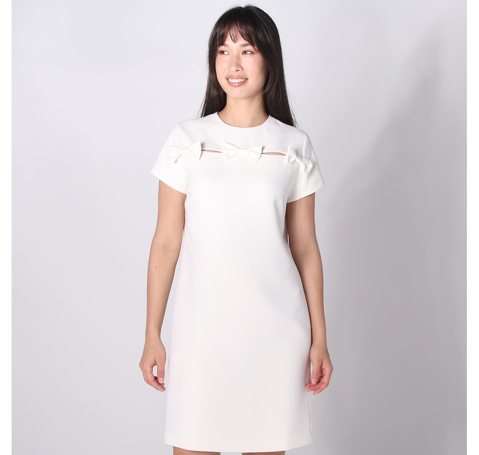 Image 242421_CRME.jpg, Product 242-421 / Price $39.33, Tash & Sophie Trina Short Sleeve Bow Cutout Mini Dress from Tash & Sophie on TSC.ca's Fashion department