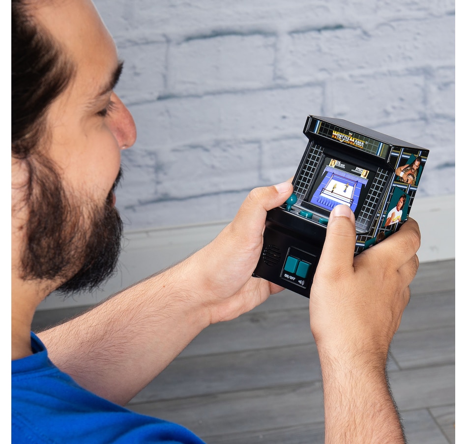 Image 711625_ALTMORE1.jpg, Product 711-625 / Price $29.99, Basic Fun Mini Classic WWE Handheld Arcade from Basic Fun on TSC.ca's Electronics department
