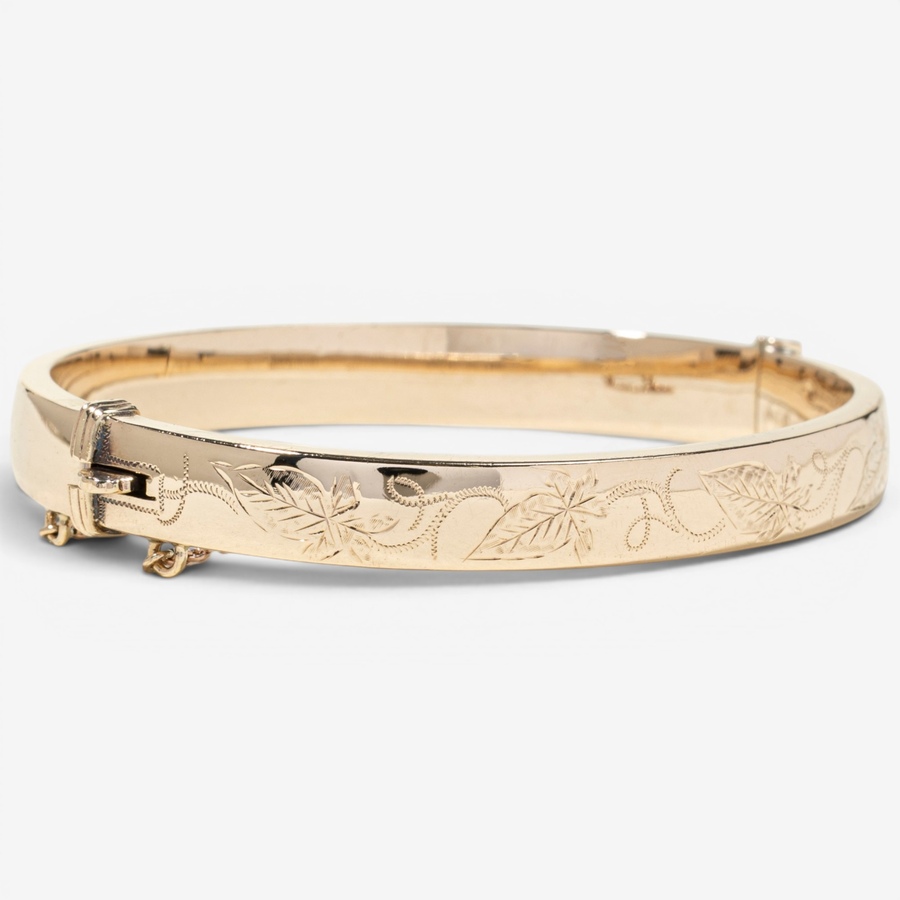 Image 755978_ALTMORE1.jpg, Product 755-978 / Price $2,295.00, Estate Originals 9K Yellow Gold Engraved Oval Bangle Bracelet, Signed "Birks" from Estate Originals on TSC.ca's Jewellery department