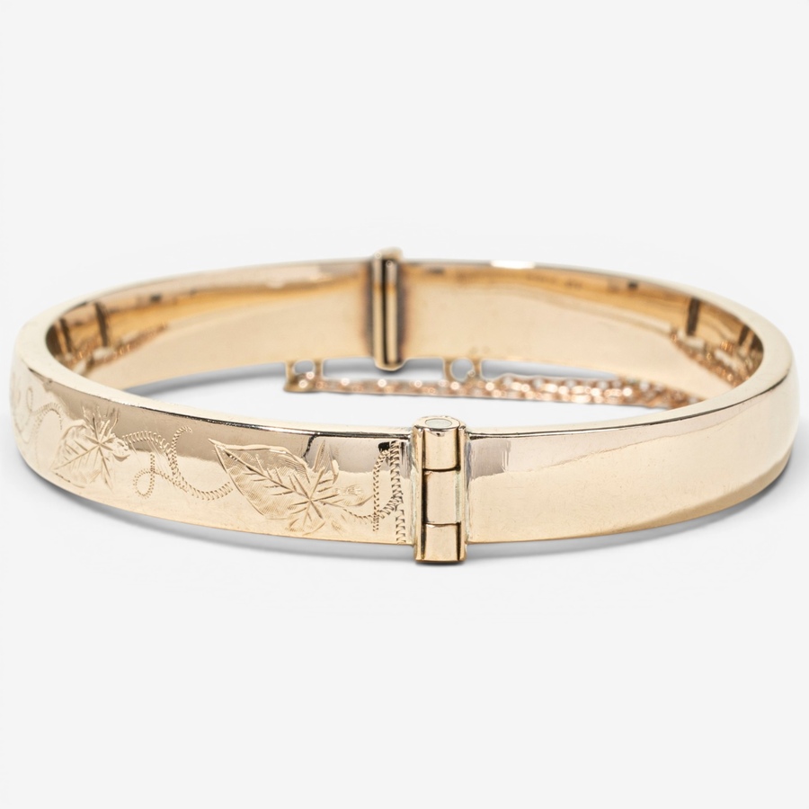 Image 755978_ALTMORE3.jpg, Product 755-978 / Price $2,295.00, Estate Originals 9K Yellow Gold Engraved Oval Bangle Bracelet, Signed "Birks" from Estate Originals on TSC.ca's Jewellery department