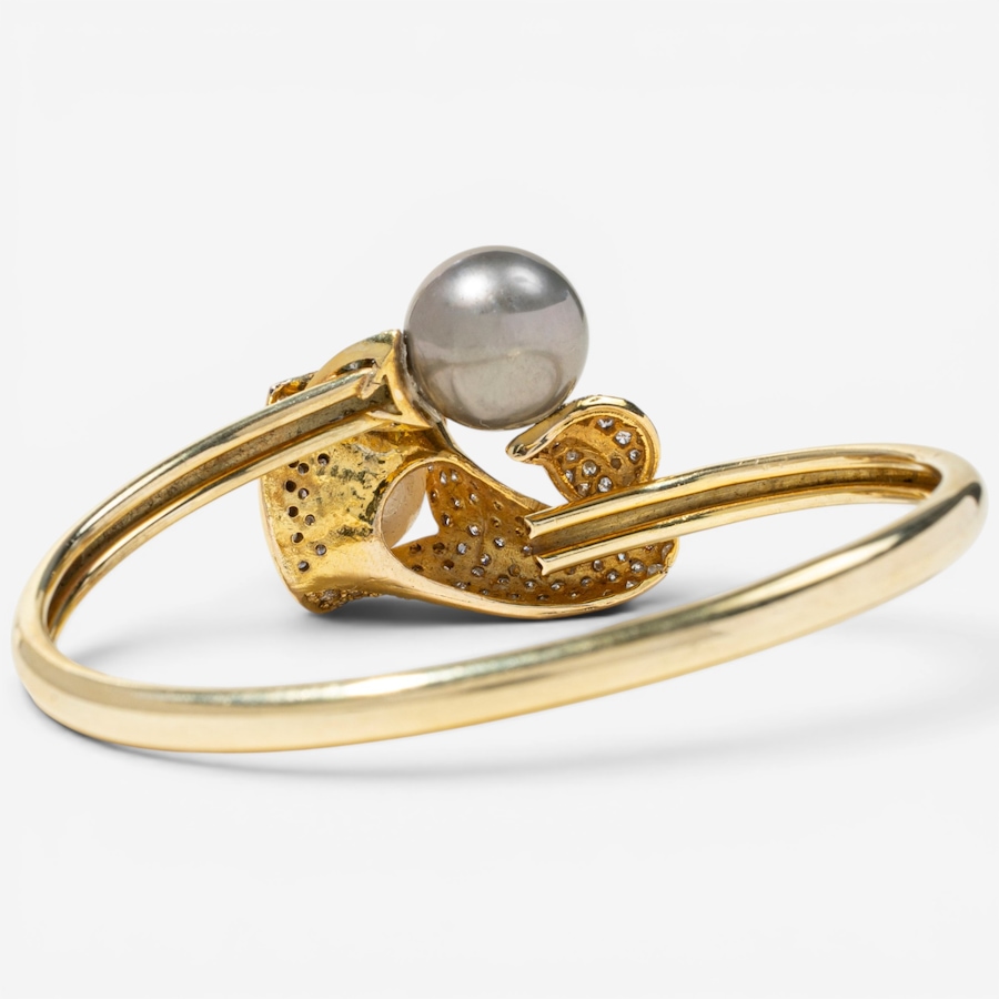 Image 756019_ALTMORE3.jpg, Product 756-019 / Price $7,595.00, Estate Originals 14K Yellow Gold Black and White South Sea Pearl and Diamond Calla Lily Motif Bangle Bracelet from Estate Originals on TSC.ca's Jewellery department