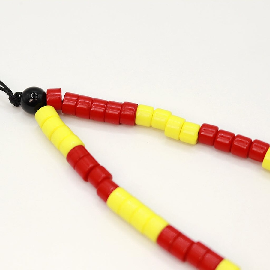 Image 899055_ALTMORE3.jpg, Product 899-055 / Price $19.99, Red And Yellow Beaded Phone Charm from Caseco on TSC.ca's Electronics department