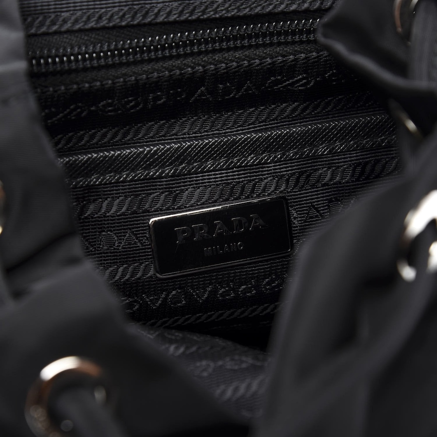 Image 961682_ALTMORE8.jpg, Product 961-682 / Price $4,055.00, Prada Re-Nylon and Saffiano Leather Trim Medium Drawstring Rucksack Backpack in Black from Prada on TSC.ca's Fashion department