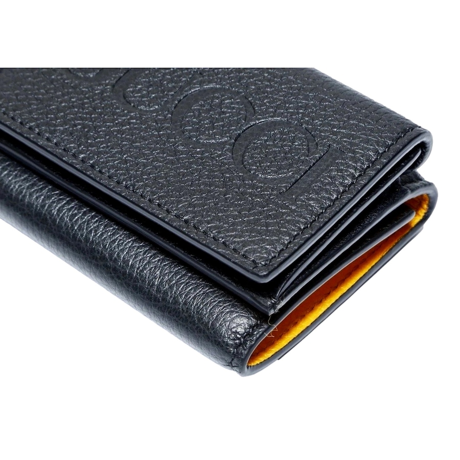 Image 981138_ALTMORE4.jpg, Product 981-138 / Price $1,193.00, Gucci Embossed Logo Mini Tri-Fold Wallet Black Yellow Pebbled Leather from Gucci on TSC.ca's Fashion department