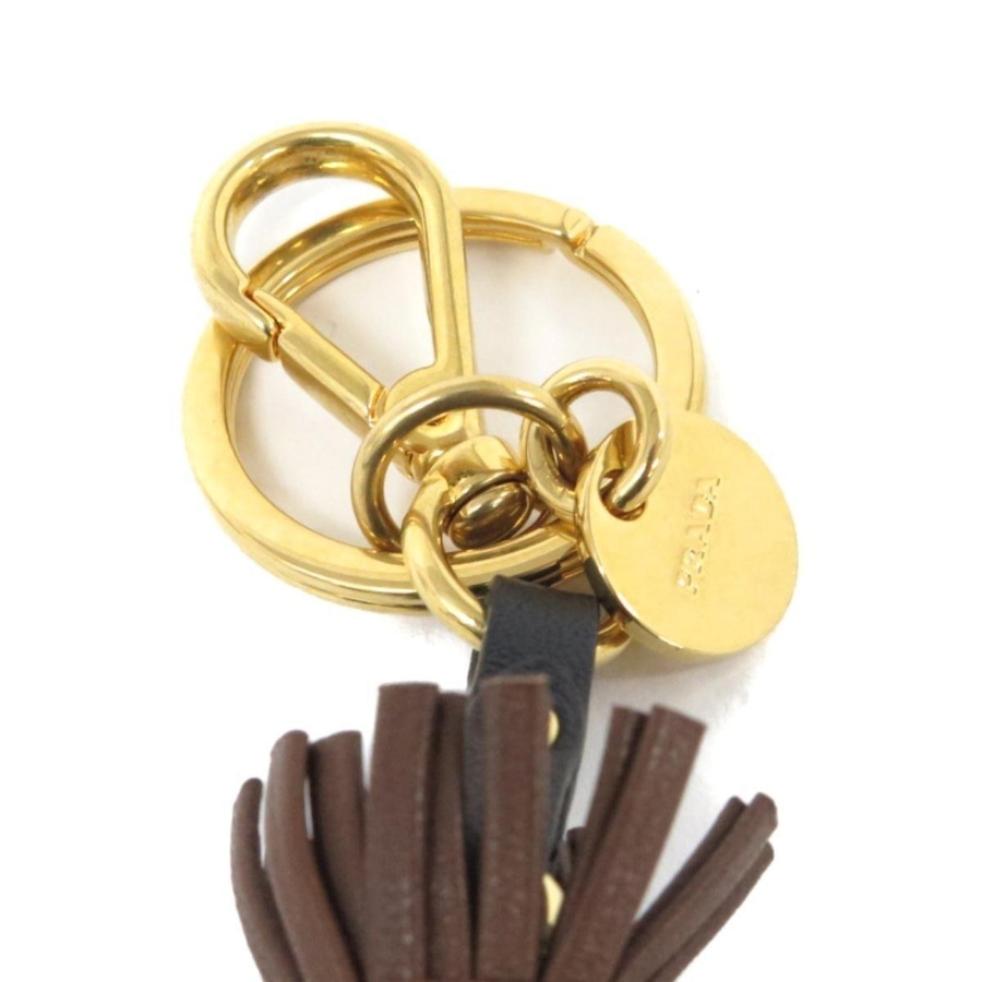 Image 993618_ALTMORE9.jpg, Product 993-618 / Price $469.00, Prada Trick Pelle Azzurro Blue Dress Jasmine Doll Keyring Key Charm from Prada on TSC.ca's Fashion department