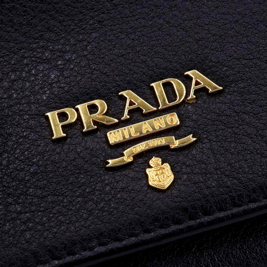 Image 997457_ALTMORE14.jpg, Product 997-457 / Price $1,423.00, Prada Vitello Grain Black Trifold Compact Wallet Leather Logo Plaque from Prada on TSC.ca's Fashion department